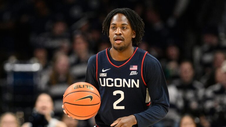 Connecticut guard Tristen Newton (2) in action during the first half of an NCAA college basketball game against Georgetown, Saturday, Feb. 10, 2024, in Washington. (AP Photo/Nick Wass)