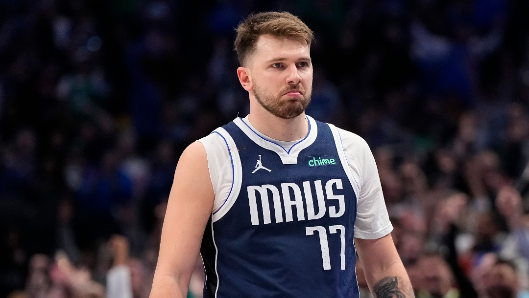 DALLAS, TEXAS - FEBRUARY 12: Luka Doncic #77 of the Dallas Mavericks reacts after making a three-point basket during the second half against the Washington Wizards at American Airlines Center on February 12, 2024 in Dallas, Texas. NOTE TO USER: User expressly acknowledges and agrees that, by downloading and or using this photograph, User is consenting to the terms and conditions of the Getty Images License Agreement. (Photo by Sam Hodde/Getty Images)