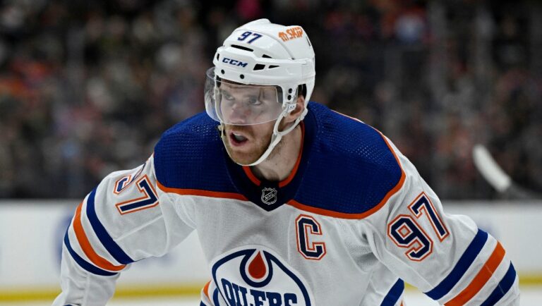 Edmonton Oilers center Connor McDavid readies for a face off against the Anaheim Ducks during the second period of an NHL hockey game in Anaheim, Calif., Friday, Feb. 9, 2024. (AP Photo/Alex Gallardo)