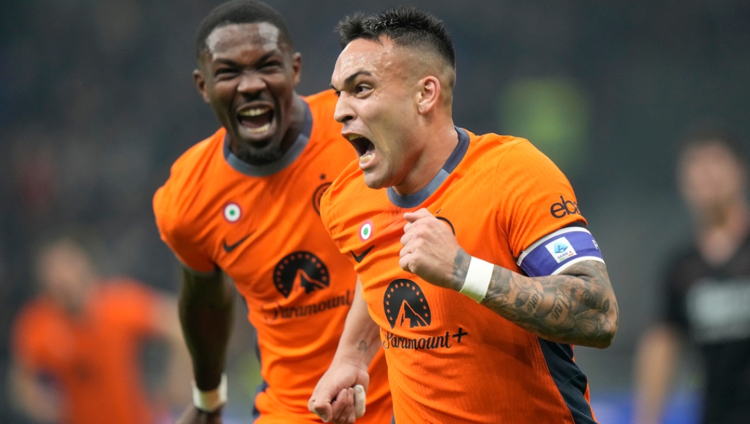 Inter Milan's Lautaro Martinez, right, celebrates with his teammate Marcus Thuram after scoring his side's second goal during the Serie A soccer match between Inter Milan and Salernitana at the San Siro stadium in Milan, Italy, Friday, Feb.16, 2023.