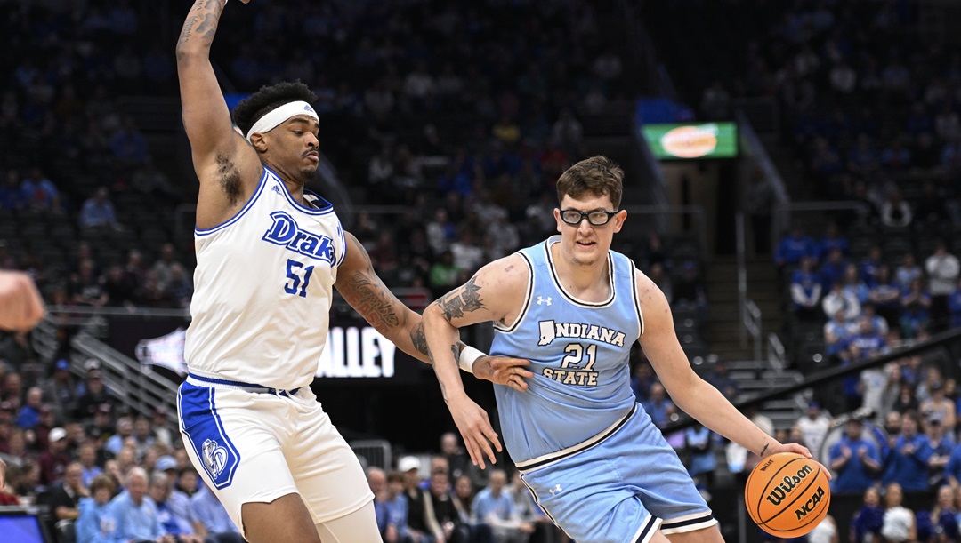 Drake's Darnell Brodie (51), left, defends against Indiana State's Robbie Avila during the first half of the championship game in the Missouri Valley Conference NCAA basketball tournament Sunday, March 10, 2024, in St. Louis.
