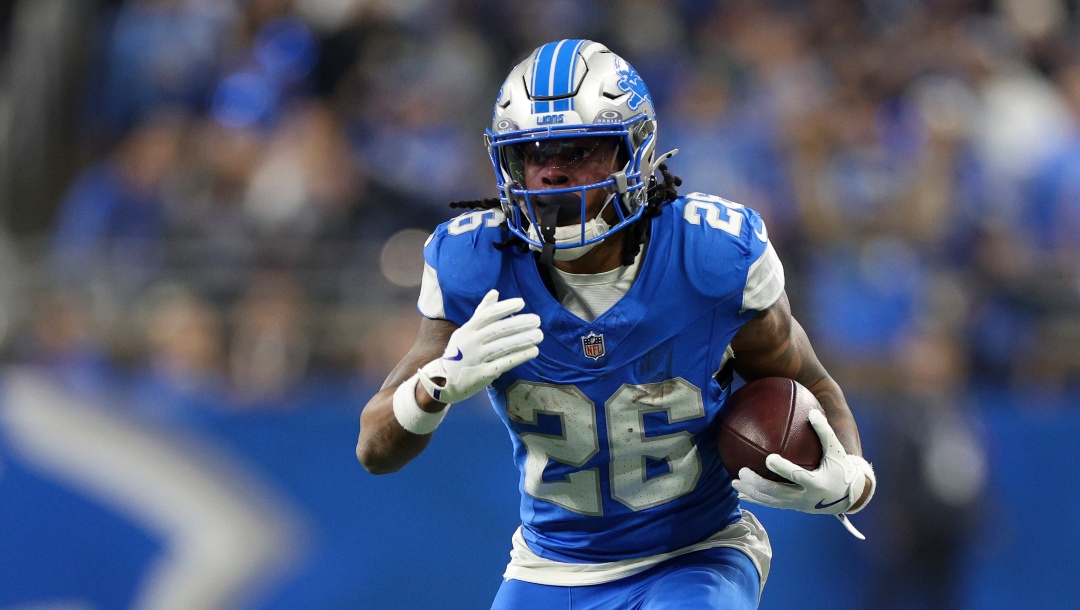 Detroit Lions running back Jahmyr Gibbs (26) runs the ball against the Washington Commanders during the first half of an NFL football divisional playoff game, Saturday, Jan. 18, 2025, in Detroit. (AP Photo/Mike Mulholland)