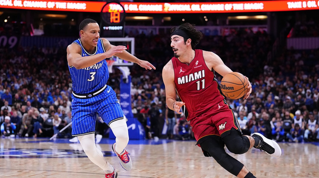ORLANDO, FLORIDA - DECEMBER 05: Jaime Jaquez Jr. #11 of the Miami Heat dribbles the ball against Desmond Bane #3 of the Orlando Magic during the first quarter at Kia Center on December 05, 2025 in Orlando, Florida. NOTE TO USER: User expressly acknowledges and agrees that, by downloading and/or using this photograph, user is consenting to the terms and conditions of the Getty Images License Agreement.