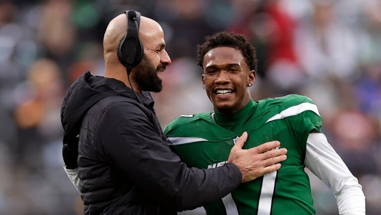 New York Jets wide receiver Garrett Wilson (17) hugs head coach Robert Saleh against the Washington Commanders during an NFL football game Sunday, Dec. 24, 2023, in East Rutherford, N.J. (AP Photo/Adam Hunger)