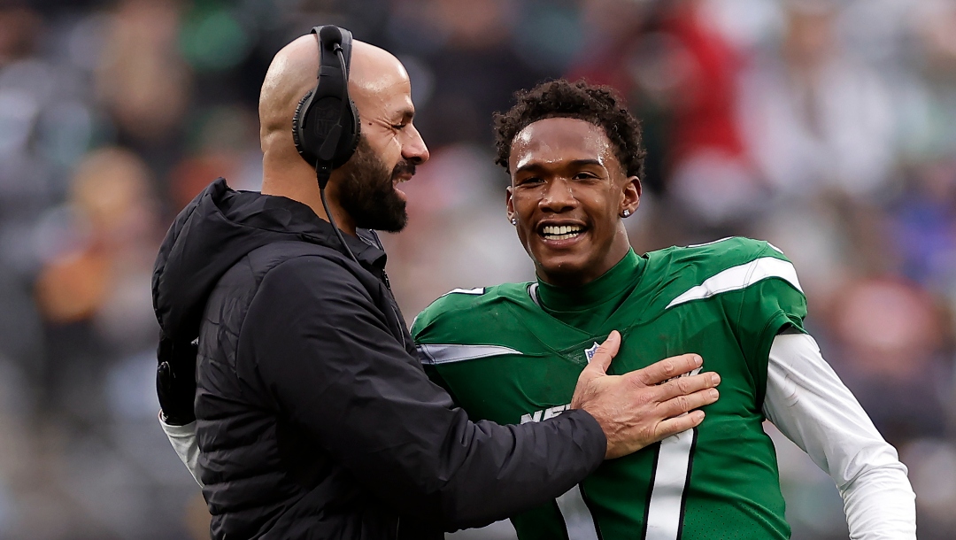 New York Jets wide receiver Garrett Wilson (17) hugs head coach Robert Saleh against the Washington Commanders during an NFL football game Sunday, Dec. 24, 2023, in East Rutherford, N.J. (AP Photo/Adam Hunger)