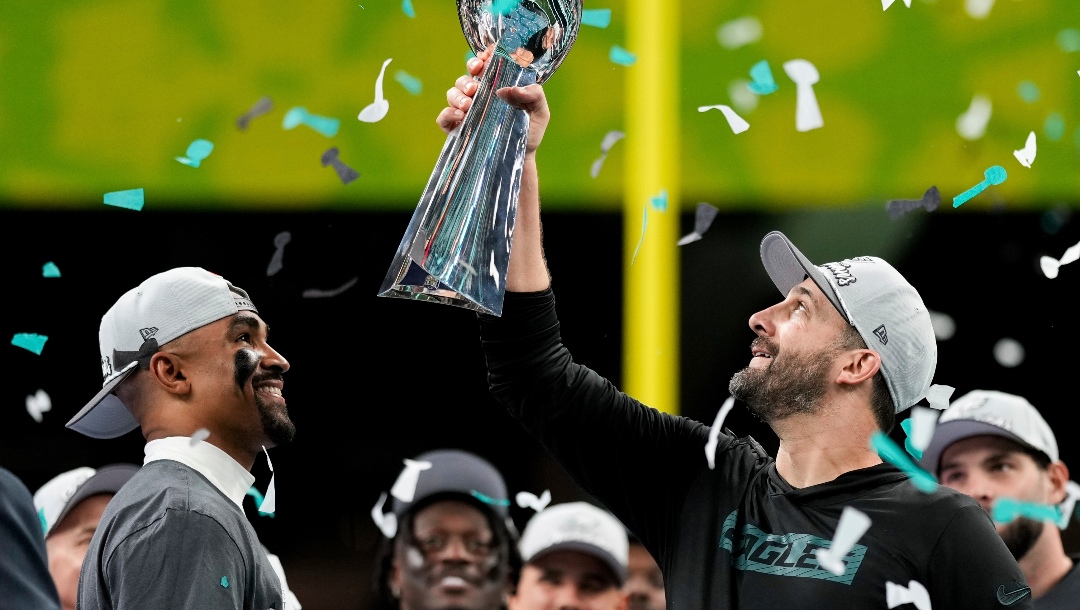 Philadelphia Eagles head coach Nick Sirianni, right, lifts the Vince Lombardi Trophy next to quarterback Jalen Hurts after defeating the Kansas City Chiefs in the NFL Super Bowl 59 football game, Sunday, Feb. 9, 2025, in New Orleans. (AP Photo/Matt Slocum)