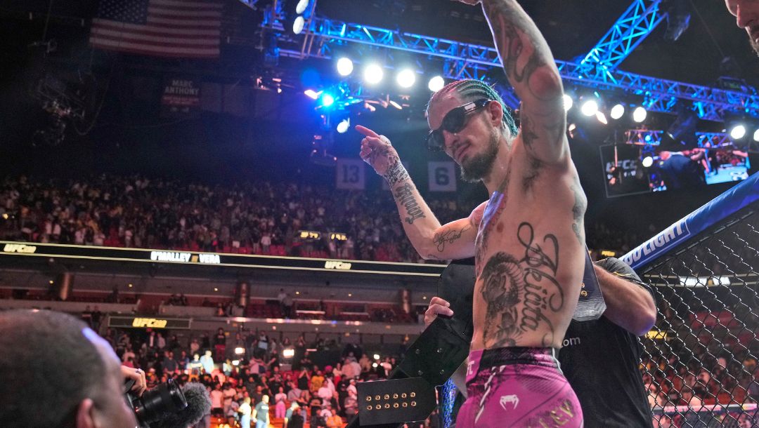 Sean O'Malley celebrates after retaining his UFC bantamweight title against Marlon Vera at the UFC 299 mixed martial arts event.