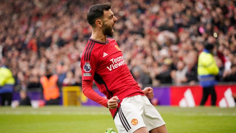 Manchester United's Bruno Fernandes, celebrates after scoring the opening goal with a penalty kick during an English Premier League soccer match between Manchester United and Everton at the Old Trafford stadium in Manchester, England, Saturday, March 9, 2024.