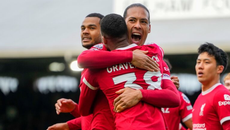 Liverpool's Ryan Gravenberch, front, celebrates with Liverpool's Virgil van Dijk after scoring his side's second goal during the English Premier League soccer match between Fulham and Liverpool at Craven Cottage stadium in London, Sunday, April 21, 2024.