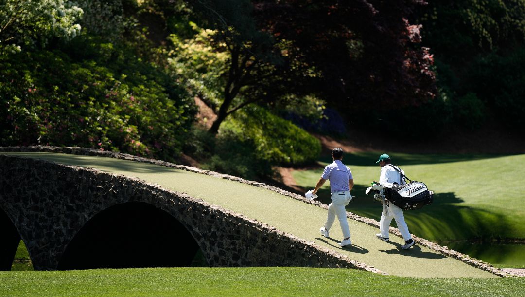 Tom Kim, of South Korea, walks to the 12th green during a practice round in preparation for the Masters golf tournament at Augusta National Golf Club Sunday, April 7, 2024, in Augusta, Ga.