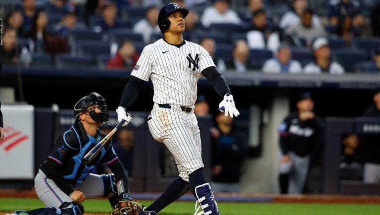 New York Yankees' Juan Soto follows through on a home run against the Miami Marlins during the fourth inning of a baseball game, Monday, April 8, 2024 in New York.
