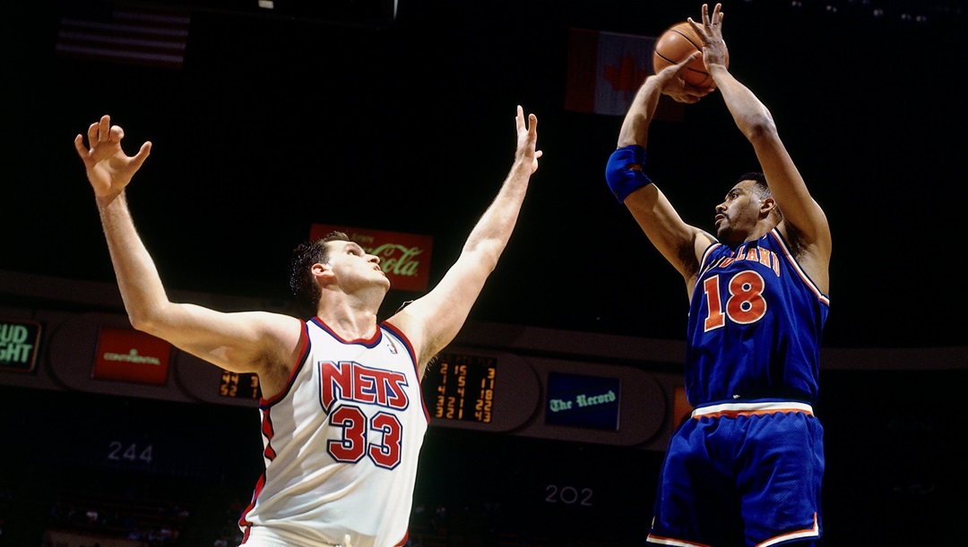 John "Hot Rod" Williams #18 of the Cleveland Cavaliers shoots against Dwayne Schintzius #33 of the New Jersey Nets during Game Three of the Eastern Conference Semifinals during the 1993 Playoffs played on May 5, 1993 at the Continental Airlines Arena in East Rutherford, New Jersey.