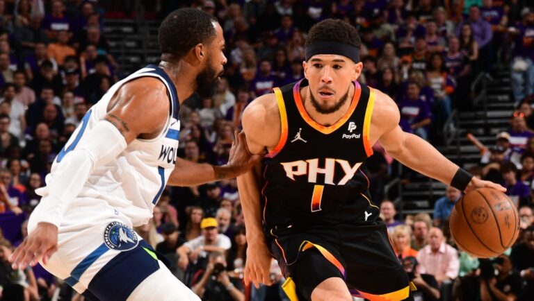 Devin Booker #1 of the Phoenix Suns handles the ball during the game against the Minnesota Timberwolves on April 26, 2024 at Footprint Center in Phoenix, Arizona.