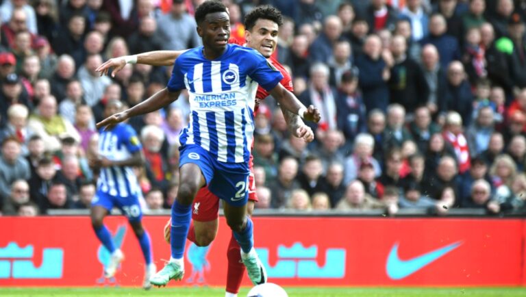Brighton's Simon Adingra, left, challenges for the ball with Liverpool's Luis Diaz during the English Premier League soccer match between Liverpool and Brighton and Hove at Anfield Stadium in Liverpool, England, Sunday, March 31, 2024.