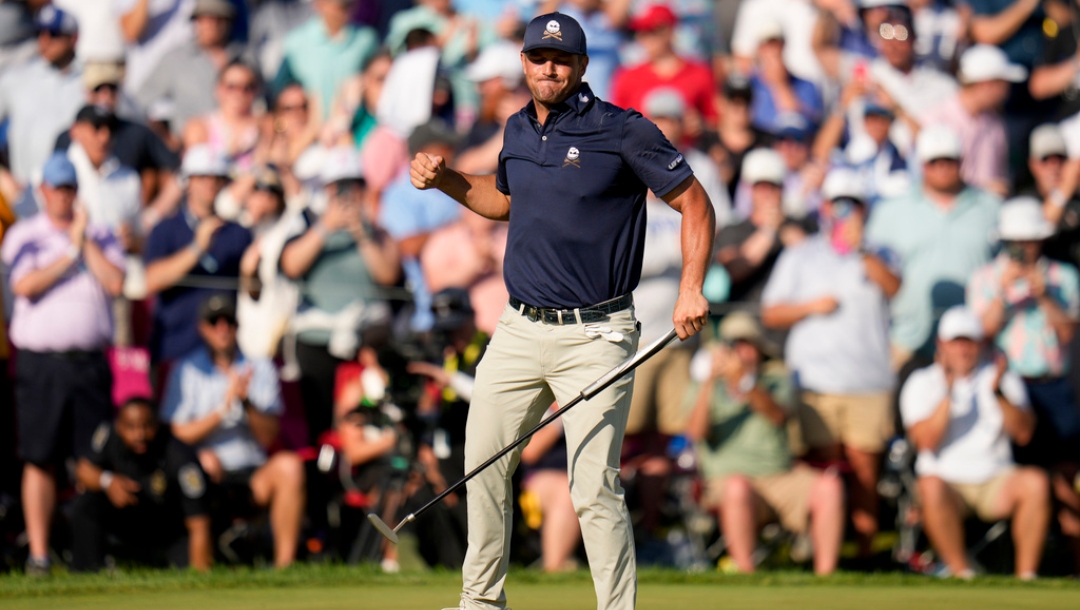 Bryson DeChambeau celebrates after a birdie on the 18th hole during the final round of the PGA Championship golf tournament at the Valhalla Golf Club, Sunday, May 19, 2024, in Louisville, Ky.
