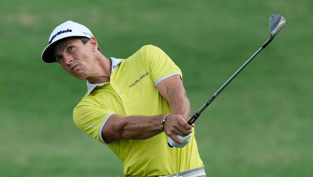 Thorbjorn Olesen of Denmark plays his second shot on the 18th hole during the round three of the DP World Tour Championship golf tournament, in Dubai, United Arab Emirates, Saturday, Nov. 18, 2023.