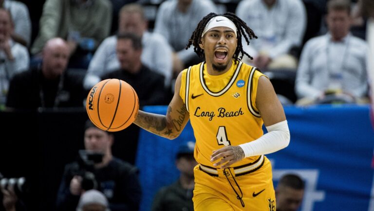 Long Beach State guard Messiah Thompson (4) brings the ball up court against Arizona during the second half of a first-round college basketball game in the NCAA Tournament in Salt Lake City, Thursday, March 21, 2024.