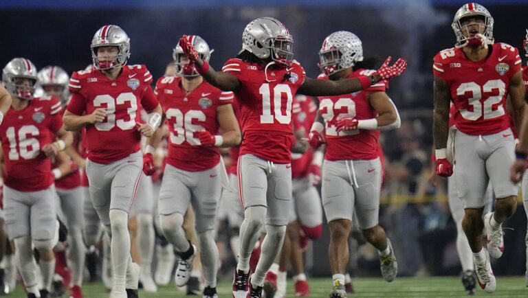 Ohio State players take the field before the Cotton Bowl NCAA college football game against Missouri Friday, Dec. 29, 2023, in Arlington, Texas.