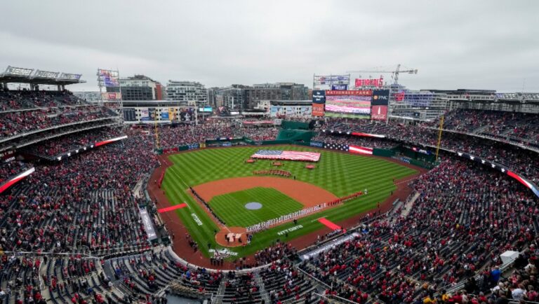 The Pittsburgh Pirates and Washington Nationals stand on the field during the national anthem before an opening day baseball game in this general view at Nationals Park, Monday, April 1, 2024, in Washington. Pirates won 8-4.