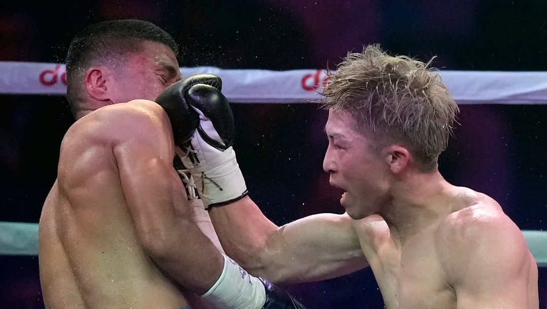 Naoya Inoue of Japan, right, punches Marlon Tapales of the Philippines in the eighth round of their boxing match.