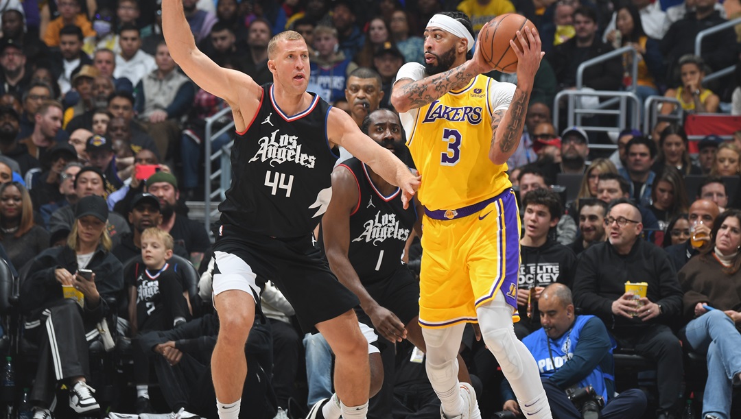 LOS ANGELES, CA - FEBRUARY 28: Anthony Davis #3 of the Los Angeles Lakers handles the ball during the game against the LA Clippers on February 28, 2024 at Crypto.Com Arena in Los Angeles, California.