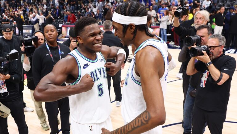 Anthony Edwards #5 and Jaden McDaniels #3 of the Minnesota Timberwolves celebrate after winning Game Seven of the Western Conference Second Round Playoffs against the Denver Nuggets at Ball Arena on May 19, 2024 in Denver, Colorado.