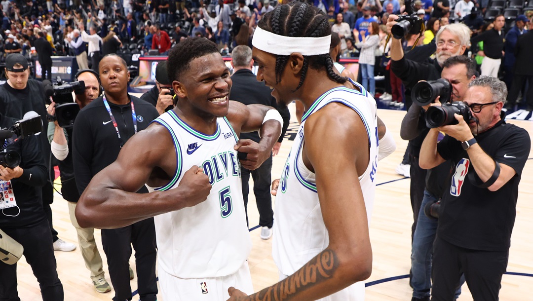 Anthony Edwards #5 and Jaden McDaniels #3 of the Minnesota Timberwolves celebrate after winning Game Seven of the Western Conference Second Round Playoffs against the Denver Nuggets at Ball Arena on May 19, 2024 in Denver, Colorado.