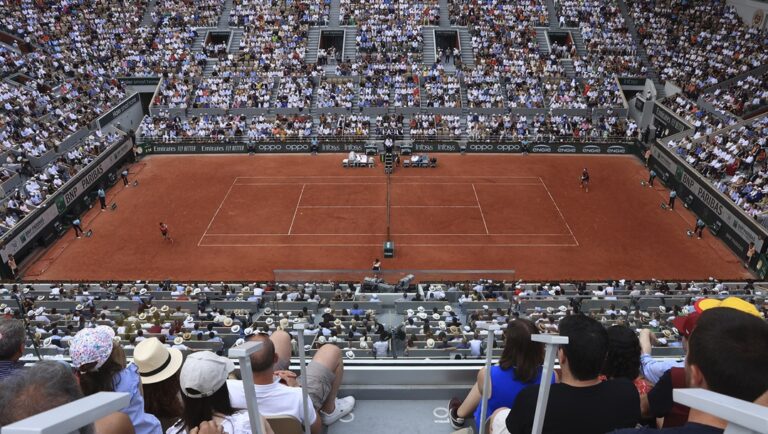 People watch the final match of the French Open tennis tournament between Serbia's Novak Djokovic and Norway's Casper Ruud at the Roland Garros stadium in Paris, Sunday, June 11, 2023. Tennis fans hoping to get tickets for this year's French Open will only be able to buy them using an official application on their phones, the French tennis federation said Tuesday, March 12, 2024.
