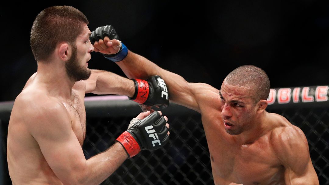 Khabib Nurmagomedov, left, fights Edson Barboza during a lightweight mixed martial arts bout at UFC 219, Saturday, Dec. 30, 2017.