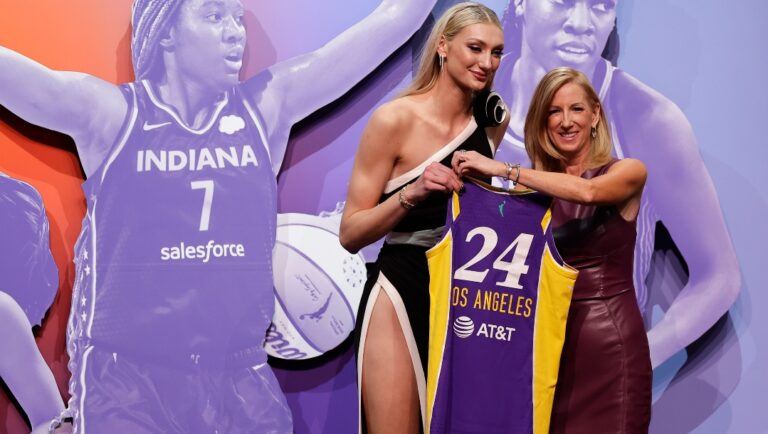 Stanford's Cameron Brink, left, poses for a photo with WNBA commissioner Cathy Engelbert after being selected second over by the Los Angeles Sparks during the first round of the WNBA basketball draft, Monday, April 15, 2024, in New York.