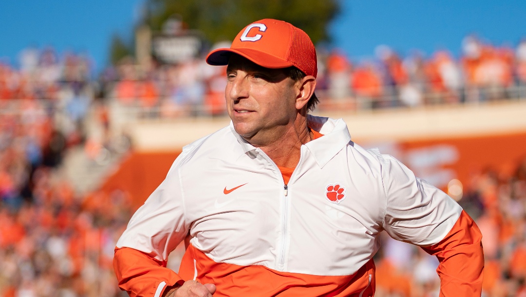 FILE - Clemson head coach Dabo Swinney runs onto the field before an NCAA college football game against North Carolina Saturday, Nov. 18, 2023, in Clemson, S.C. Clemson tries to end its worst season since 2010 with a five-game winning streak when it plays Kentucky in the Gator Bowl.(AP Photo/Jacob Kupferman,File)