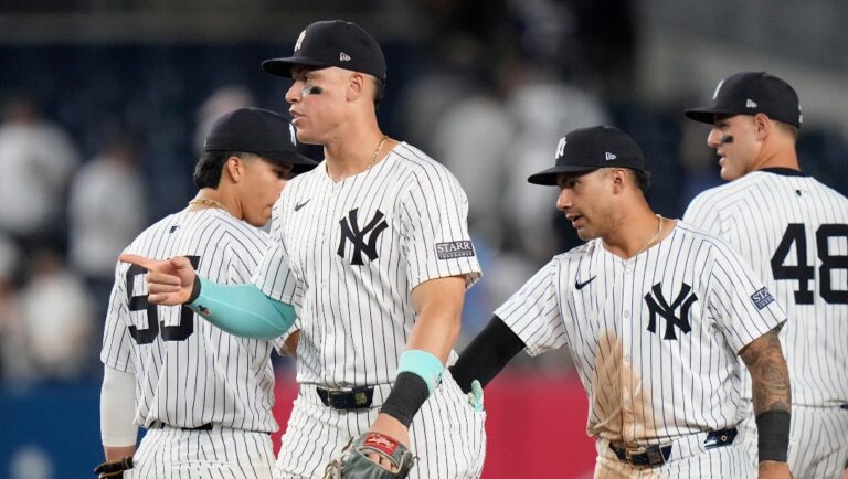 New York Yankees' Aaron Judge, left, and Gleyber Torres, second from right, celebrate with teammates after a baseball game against the Minnesota Twins, Thursday, June 6, 2024, in New York.