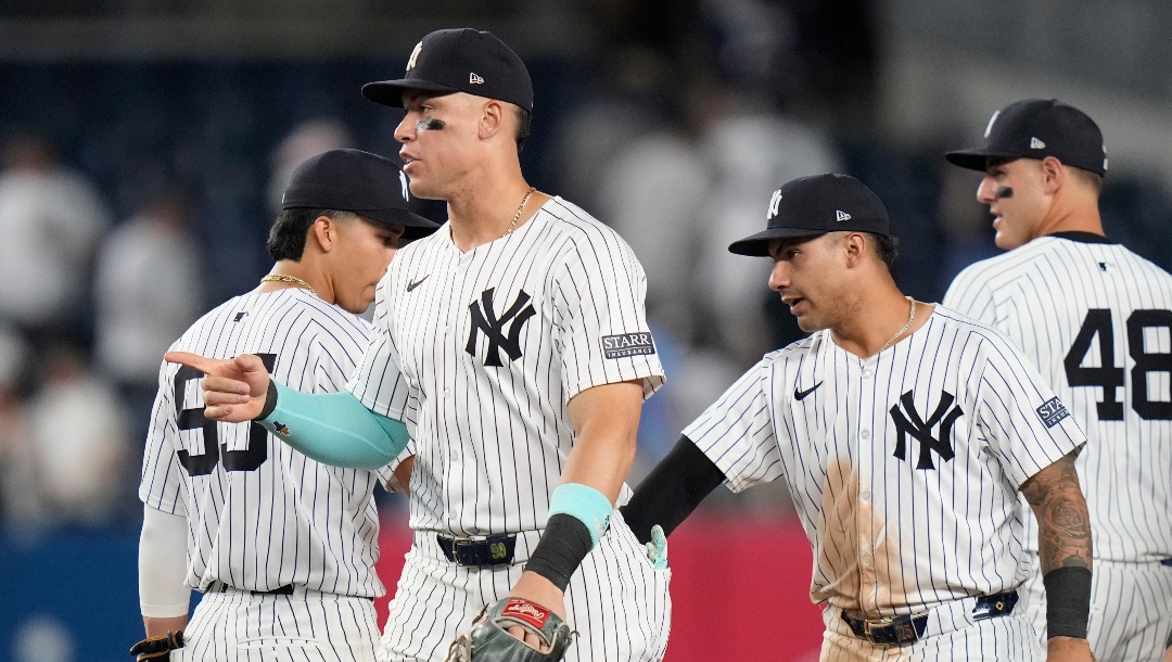 New York Yankees' Aaron Judge, left, and Gleyber Torres, second from right, celebrate with teammates after a baseball game against the Minnesota Twins, Thursday, June 6, 2024, in New York.