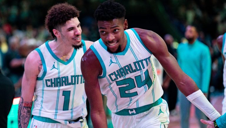 LaMelo Ball #1 of the Charlotte Hornets celebrates with Brandon Miller #24 after defeating the Detroit Pistons during their game at Spectrum Center on November 06, 2024 in Charlotte, North Carolina.