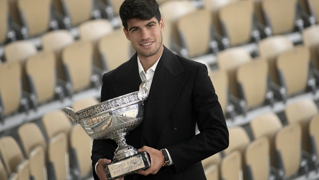 Spain's Carlos Alcaraz holds the trophy as he poses for media after the French Open tennis tournament at the Roland Garros stadium in Paris, Monday, June 10, 2024. Alcaraz won the title on Sunday in the final against Germany's Alexander Zverev.