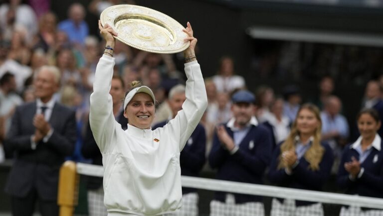 Czech Republic's Marketa Vondrousova celebrates with the trophy after beating Tunisia's Ons Jabeur in the women's singles final on day thirteen of the Wimbledon tennis championships in London, Saturday, July 15, 2023. This year's Wimbledon tournament begins on Monday, July 1.
