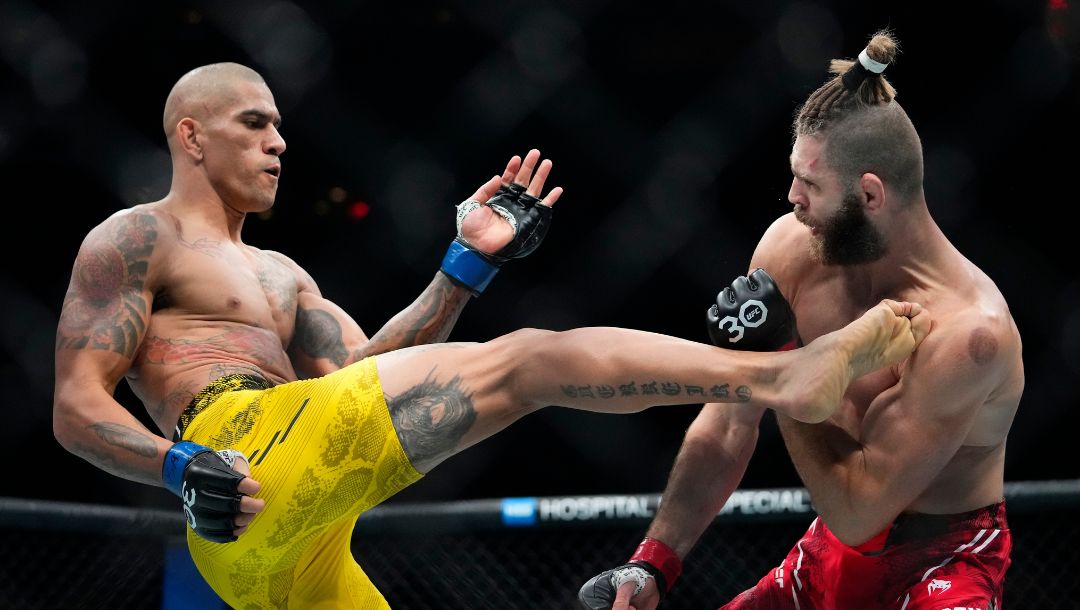 Brazil's Alex Pereira, left, kicks Czech Republic's Jirí Procházka during the second round of a light heavyweight title bout.