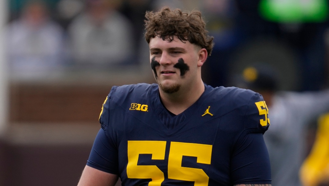 Michigan defensive lineman Mason Graham (55) warms up during the NCAA college football team's spring game in Ann Arbor, Mich., Saturday, April 20, 2024. (AP Photo/Paul Sancya)