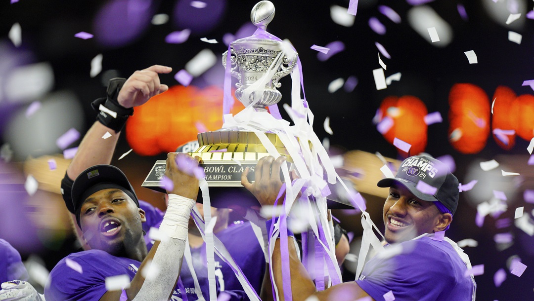 Washington linebacker Edefuan Ulofoshio (5), on the left, and quarterback Michael Penix Jr. (9), on the right, celebrate after defeating Texas during the Sugar Bowl CFP NCAA semifinal college football game, Monday, Jan. 1, 2024, in New Orleans. ESPN and the College Football Playoff have agreed to a six-year deal worth $1.3 billion annually that allows the network to keep exclusive rights to the 12-team playoff through the 2031 season, two people with knowledge of the agreement told The Associated Press, Tuesday, Feb. 13, 2024.