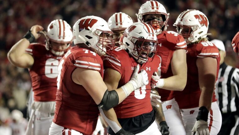 Wisconsin's Braelon Allen is congratulated by teammates during overtime of an NCAA college football game against Nebraska Saturday, Nov. 18, 2023 in Madison, Wis.