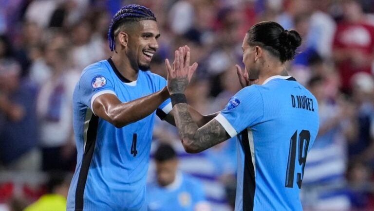 Uruguay's Ronald Araujo, left, and Darwin Nunez, right, celebrate after they defeated the United States in an Copa America Group C soccer match, Monday, July 1, 2024, in Kansas City, Mo.