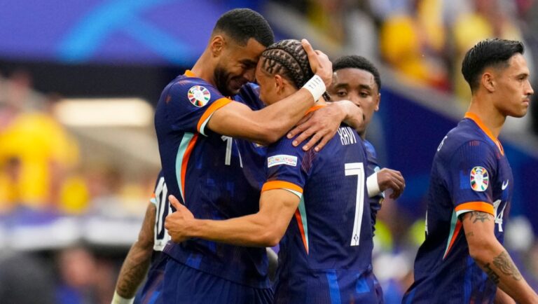Cody Gakpo of the Netherlands, left, celebrates with Xavi Simons after scoring the opening goal during a round of sixteen match between Romania and the Netherlands at the Euro 2024 soccer tournament in Munich, Germany, Tuesday, July 2, 2024.