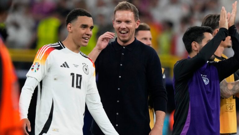 Germany's head coach Julian Nagelsmann, center, and Jamal Musiala celebrate after a round of sixteen match between Germany and Denmark at the Euro 2024 soccer tournament in Dortmund, Germany, Saturday, June 29, 2024. Germany won 2-0.
