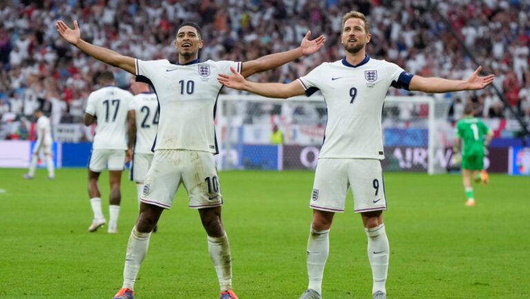 England's Jude Bellingham, left, celebrates his goal with Harry Kane during a round of sixteen match between England and Slovakia at the Euro 2024 soccer tournament in Gelsenkirchen, Germany, Sunday, June 30, 2024.