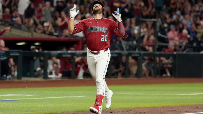 Arizona Diamondbacks' Eugenio Suárez looks up as he rounds the bases after hitting a home run against the Houston Astros during the third inning of a baseball game Monday, July 21, 2025, in Phoenix.