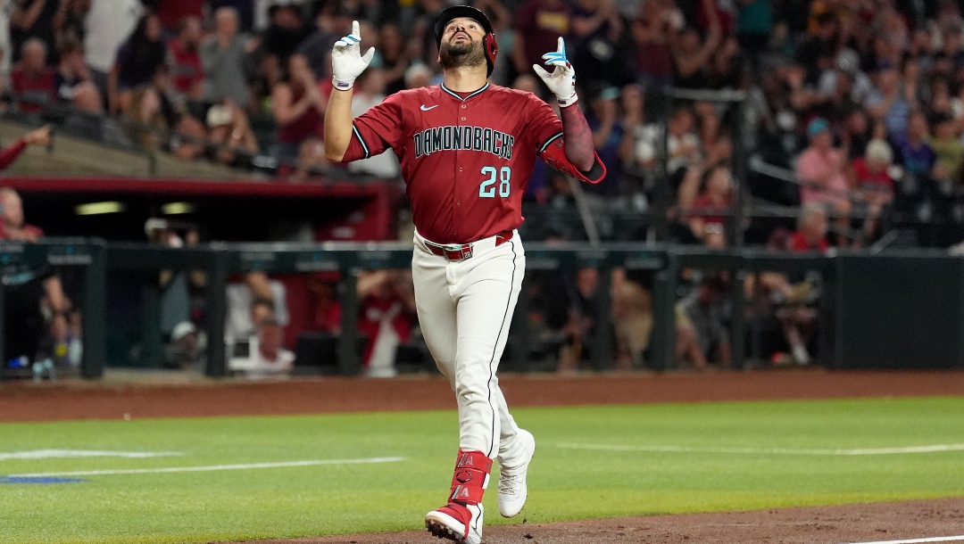 Arizona Diamondbacks' Eugenio Suárez looks up as he rounds the bases after hitting a home run against the Houston Astros during the third inning of a baseball game Monday, July 21, 2025, in Phoenix.