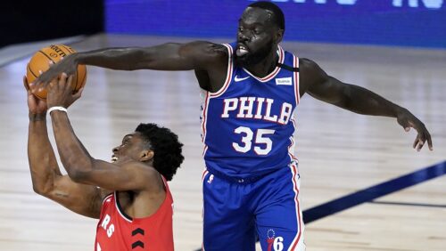 LAKE BUENA VISTA, FLORIDA - AUGUST 12: Stanley Johnson #5 of the Toronto Raptors tries to shoot as Marial Shayok #35 of the Philadelphia 76ers defends during the second half at The Field House at ESPN Wide World Of Sports Complex on August 12, 2020 in Lake Buena Vista, Florida.