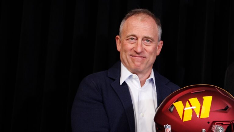 Washington Commanders owner Josh Harris, left, and Adam Peters, right, pose for a photo after Peters was introduced as the team's new general manager during an NFL press conference, Tuesday, Jan. 16, 2024, in Ashburn, Va. (AP Photo/Luis M. Alvarez)