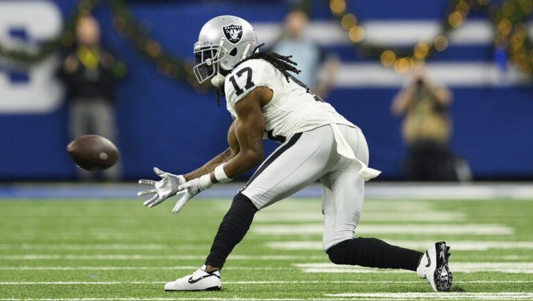 Las Vegas Raiders wide receiver Davante Adams (17) reaches out for a pass during an NFL football game against the Indianapolis Colts, Sunday, Dec. 31, 2023, in Indianapolis.