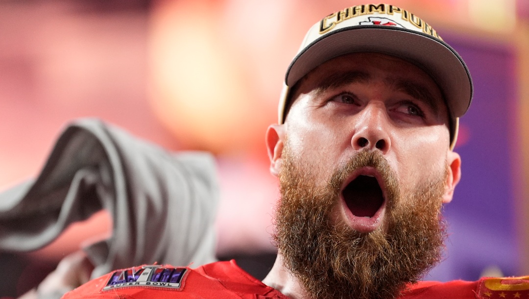 Kansas City Chiefs tight end Travis Kelce (87) celebrates while holding the Vince Lombardi Trophy after the NFL Super Bowl 58 football game against the San Francisco 49ers, Sunday, Feb. 11, 2024, in Las Vegas. The Chiefs won 25-22. (AP Photo/Ashley Landis)